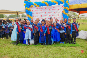 Preschool and graduating students in colorful attire smiling while receiving awards at Powerfields Schools, a top school in Ikorodu and Lagos