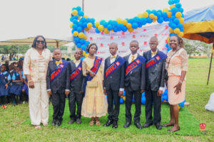 Preschool and graduating students in colorful attire smiling while receiving awards at Powerfields Schools, a top school in Ikorodu and Lagos