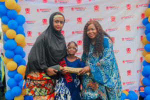 Preschool and graduating students in colorful attire smiling while receiving awards at Powerfields Schools, a top school in Ikorodu and Lagos