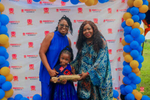 Preschool and graduating students in colorful attire smiling while receiving awards at Powerfields Schools, a top school in Ikorodu and Lagos