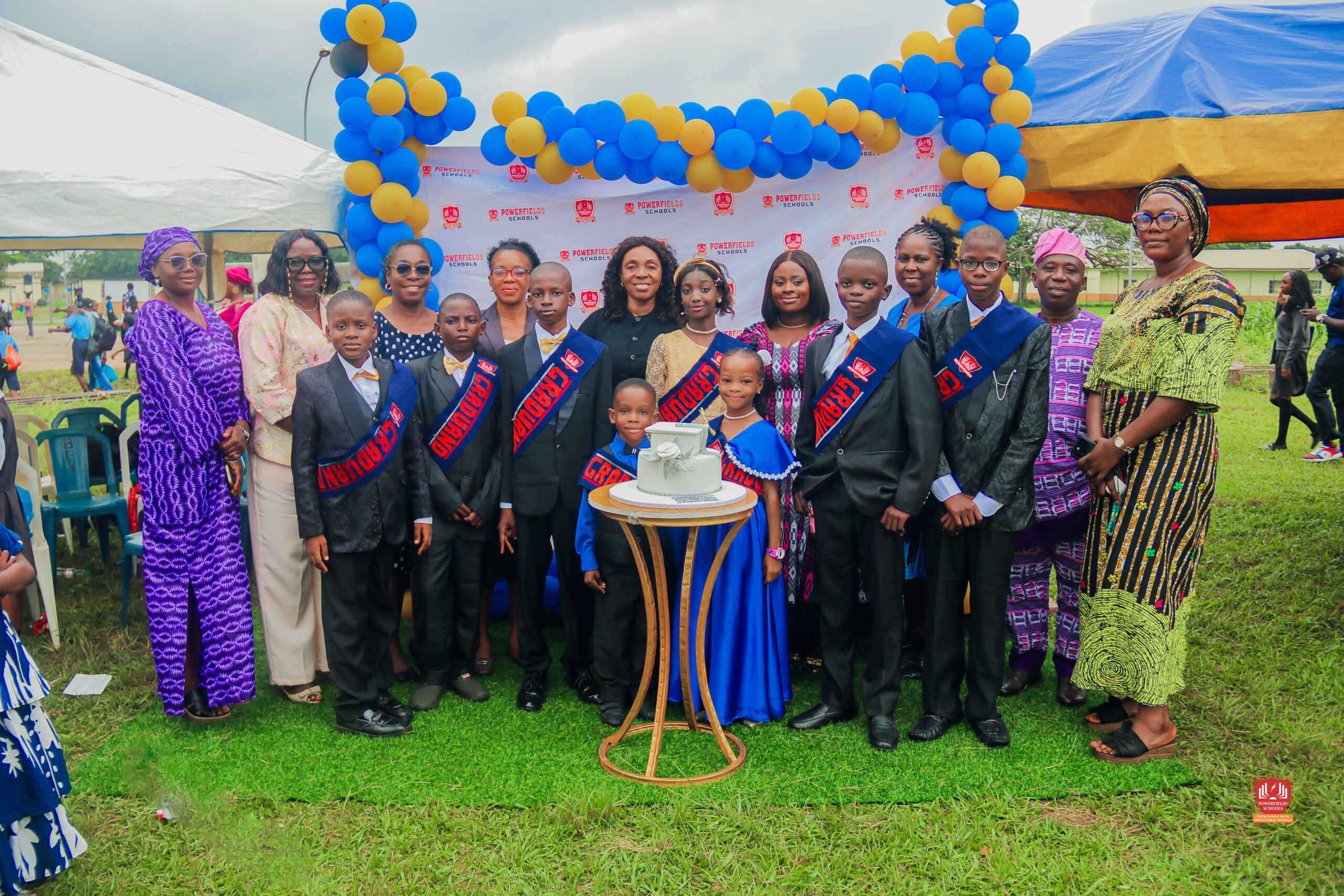 Preschool and graduating students in colorful attire smiling while receiving awards at Powerfields Schools, a top school in Ikorodu and Lagos