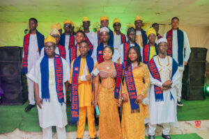 Year 12 graduates in colorful outfits smiling and receiving awards at Powerfields Schools valedictory service, a top boarding school in Lagos