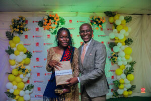 Year 12 graduates in colorful outfits smiling and receiving awards at Powerfields Schools valedictory service, a top boarding school in Lagos