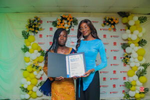 Year 12 graduates in colorful outfits smiling and receiving awards at Powerfields Schools valedictory service, a top boarding school in Lagos
