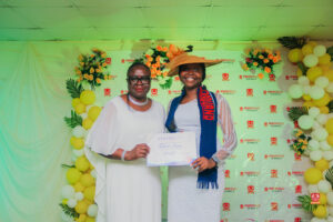 Year 12 graduates in colorful outfits smiling and receiving awards at Powerfields Schools valedictory service, a top boarding school in Lagos